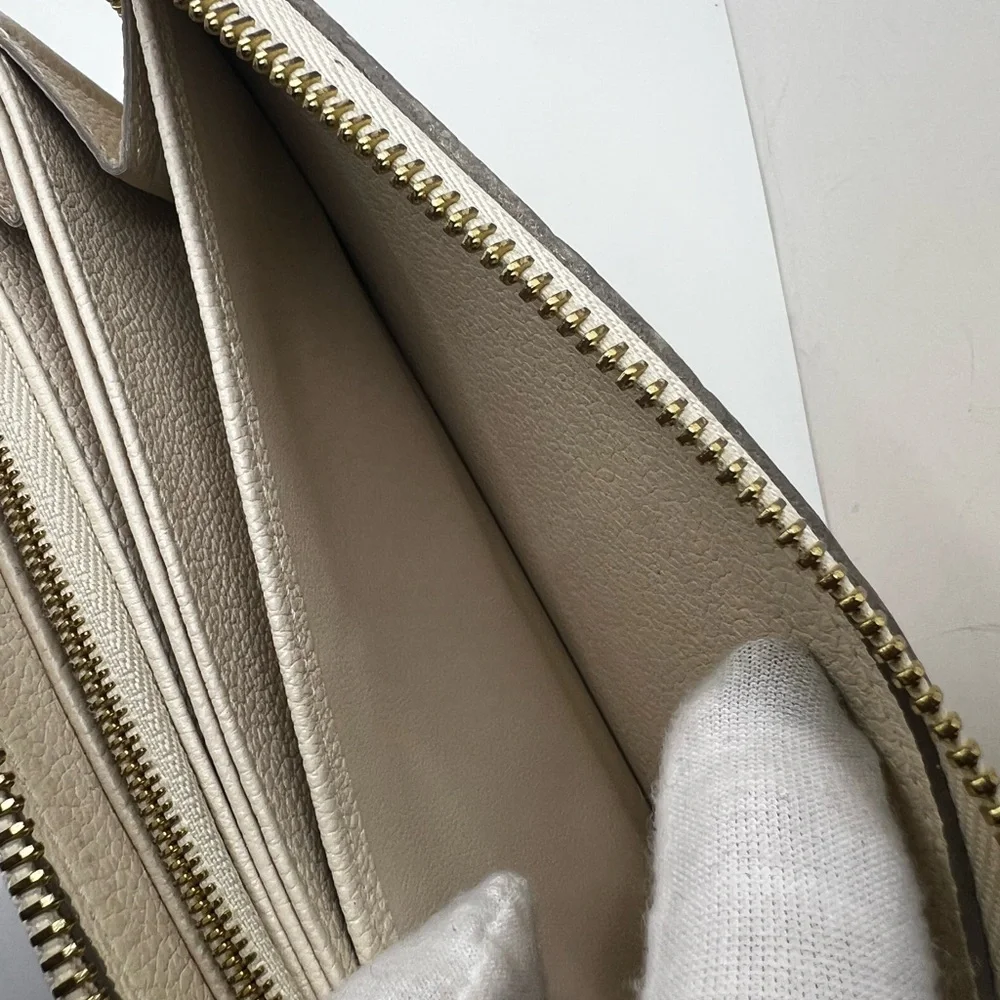 GUC Louis Vuitton Monogram Cream Empreinte Zippy Wallet - Picture 8 of 11